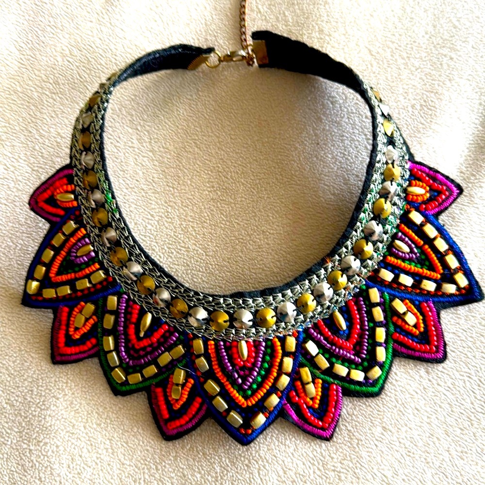 Artisan created bib beaded embroidered in golden threads soft felt backing